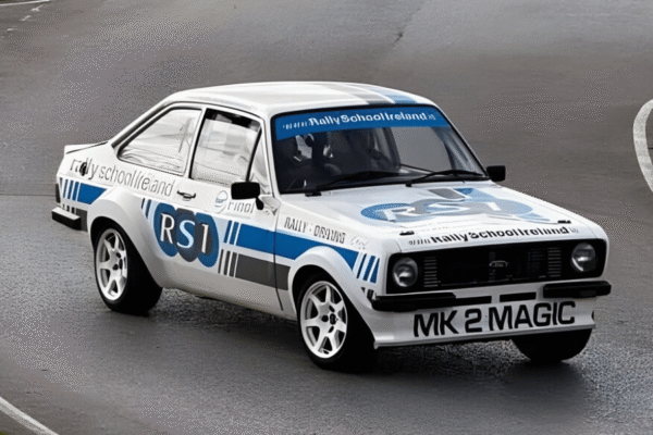 Classic rally car with Rally School Ireland branding on a track, showcasing powerful performance and sleek design.